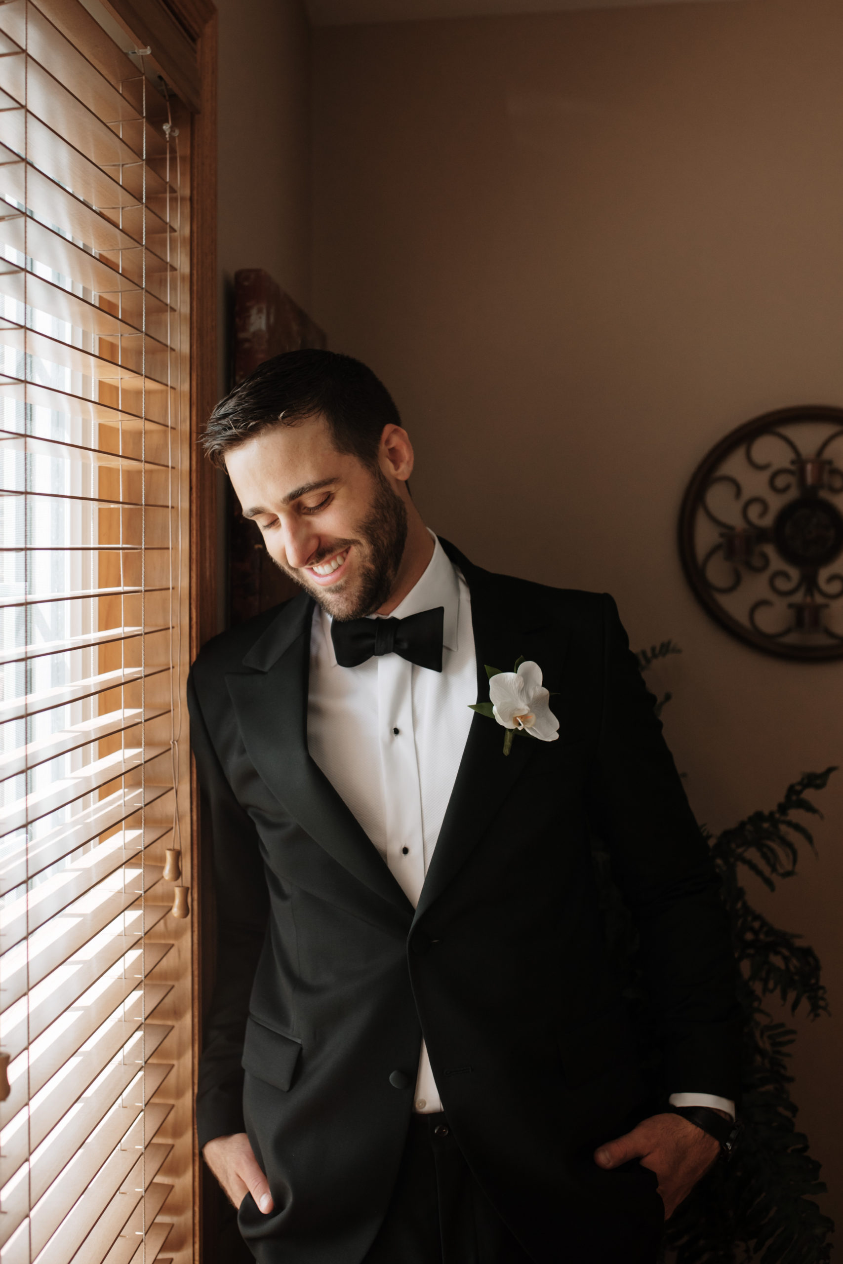 Groom laughing candidly