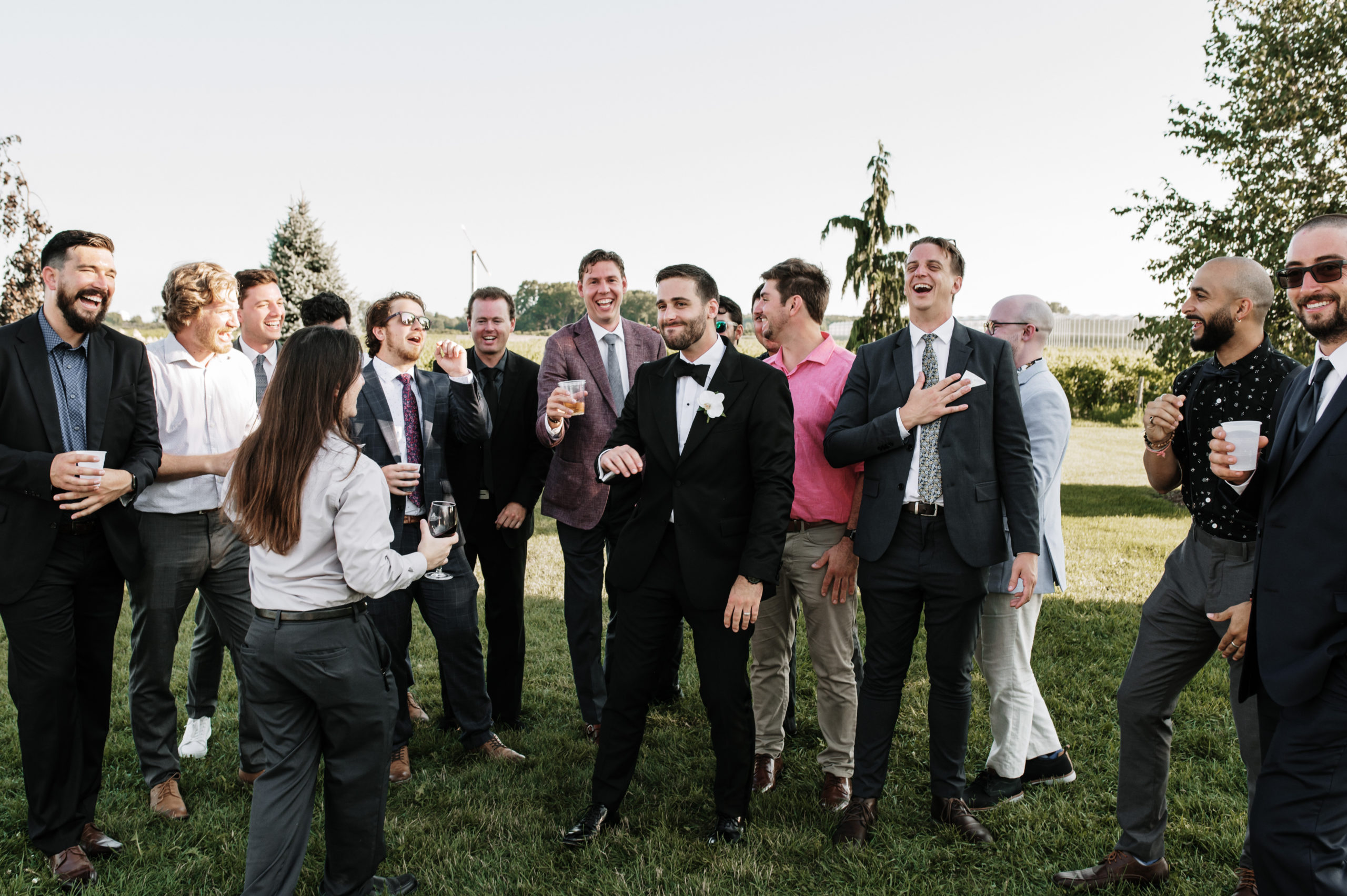 A groom celebrating his new marriage with his friends at his wedding